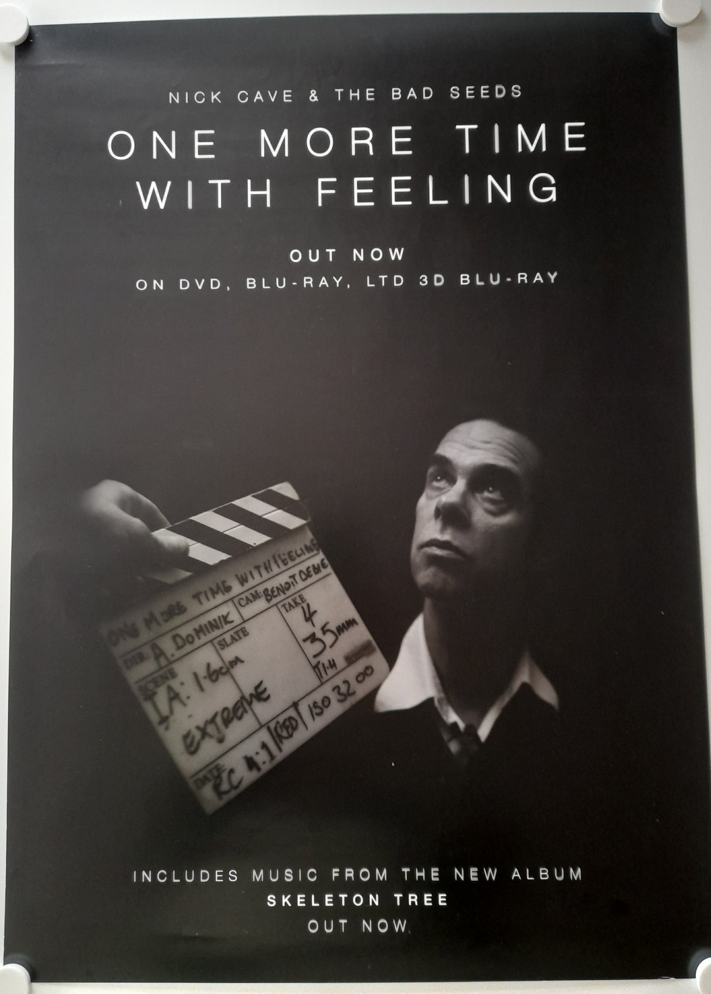 Promotional poster for Nick Cave & The Bad Seeds' 'One More Time With Feeling' with a clapperboard and text.